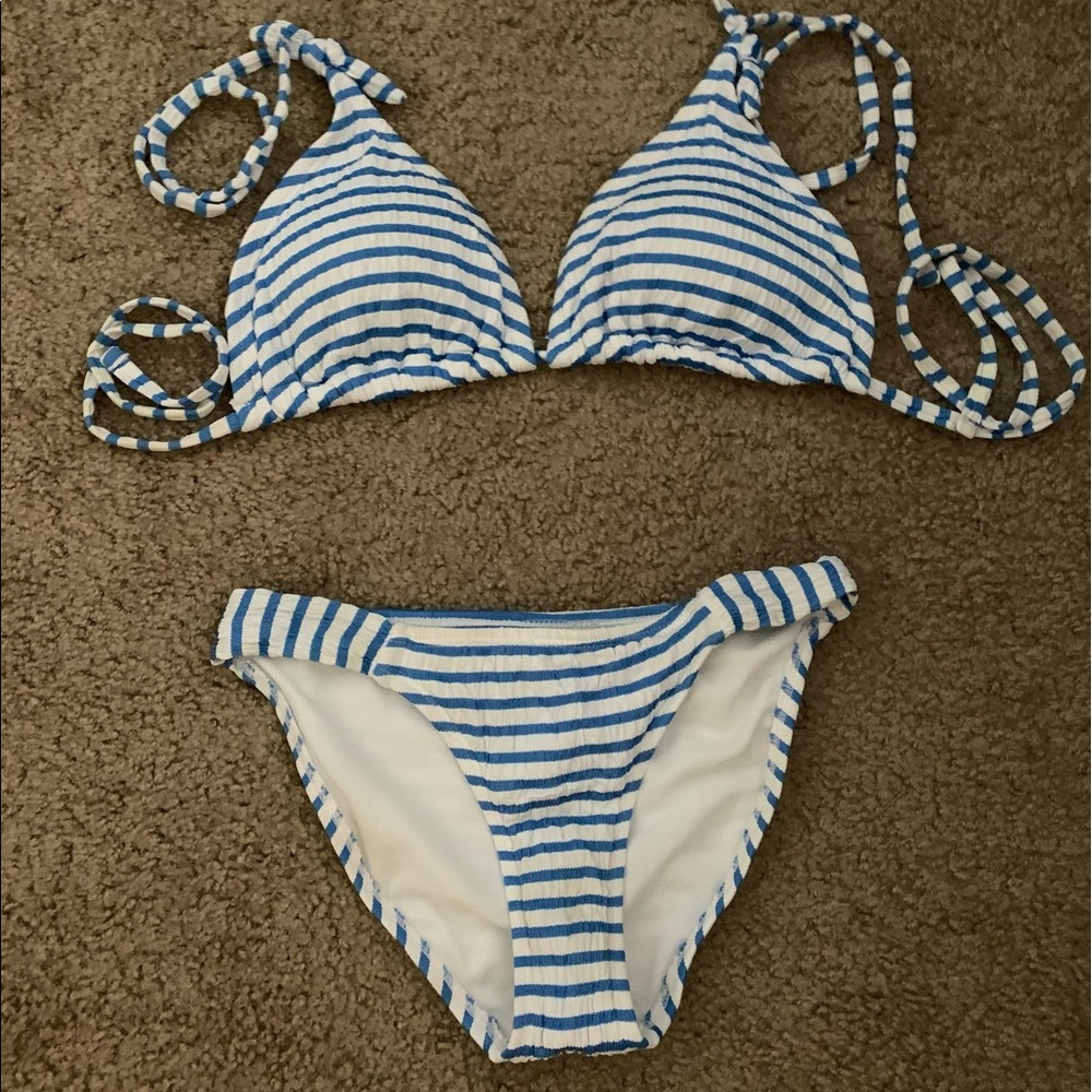 Blue and white ribbed swim suit top is XL and bottoms are XS